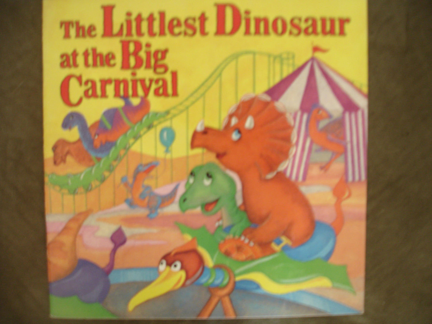 The littlest dinosaur at the big carnival