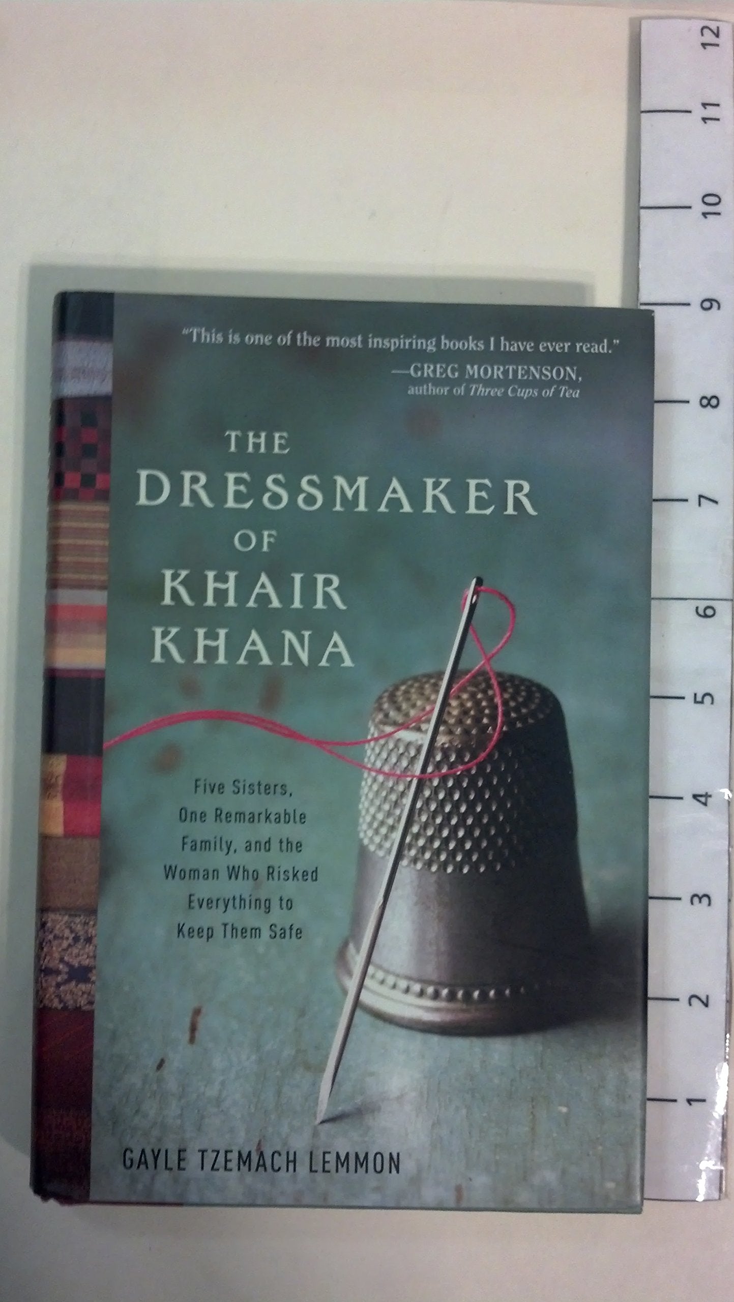 The Dressmaker of Khair Khana: Five Sisters, One Remarkable Family, and the Woman Who Risked Everything to Keep Them Safe - 2235