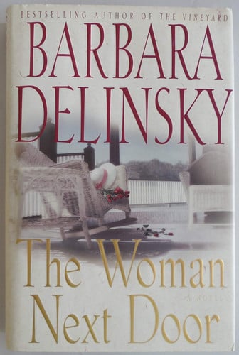 The woman next door: a novel