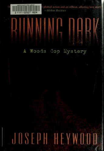 Running dark: a woods cop mystery